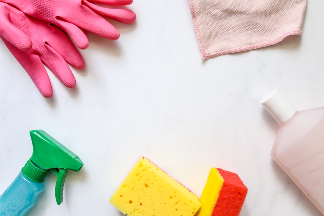 about-01 A flat lay of assorted cleaning supplies, perfect for housekeeping themes.